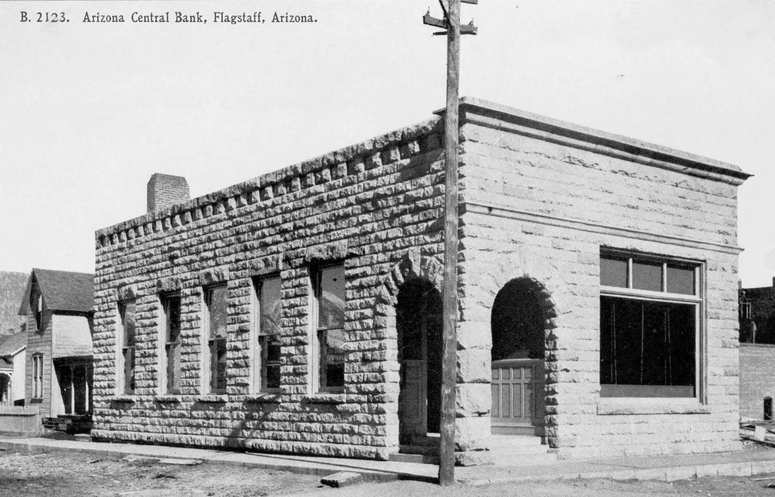Historic stone building on a street corner in Bagdad, Arizona.